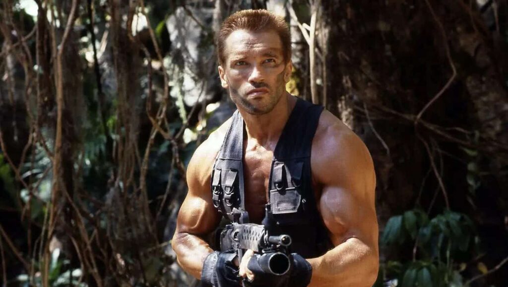 Schwarzenegger é eleito para defender o planeta contra ataque alienígena Arnold Schwarzenegger em Predador (Divulgação)