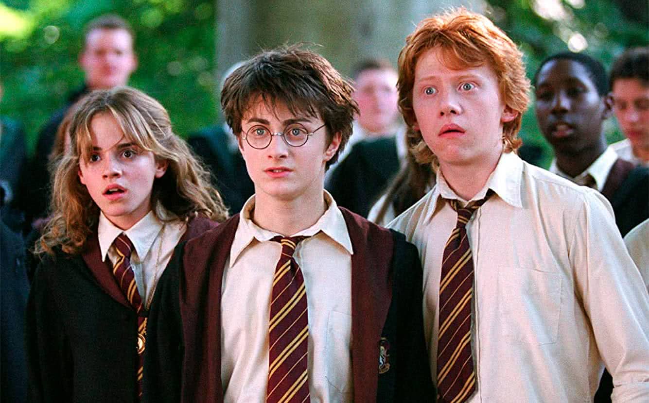 Hermione (Emma Watson), Harry (Dan Radcliffe) e Rony (Rupert Grint) em cena de Harry Potter