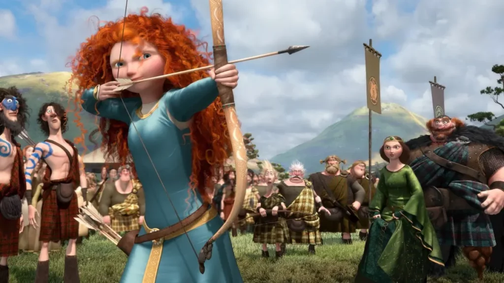 Merida em cena do filme Valente, usando vestido verde e segurando o arco.