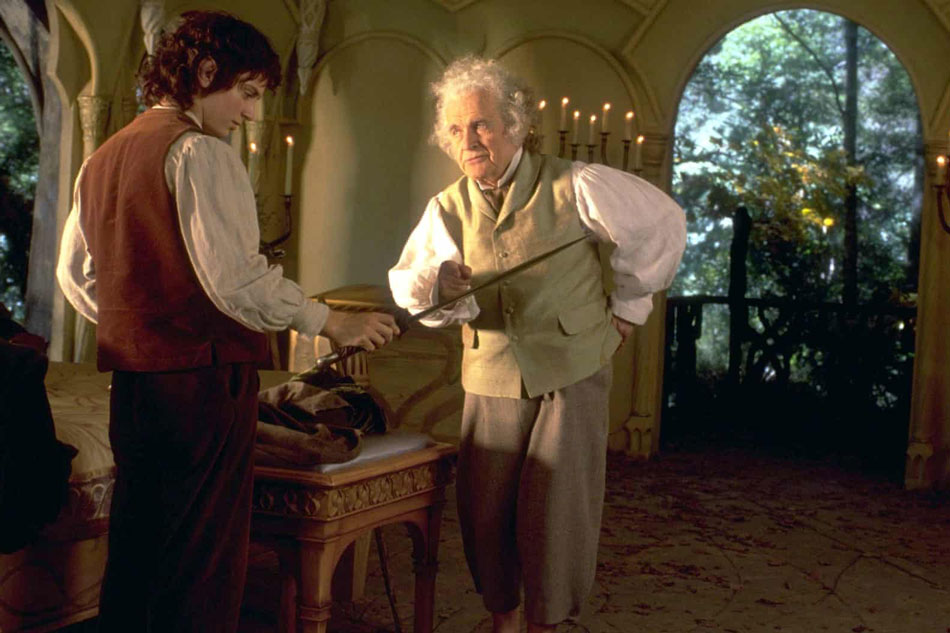 Bilbo Bolseiro (Ian Holm ) e Frodo Bolseiro (Elijah Wood)