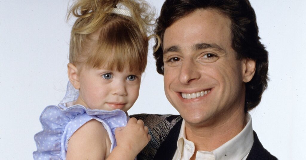 Netflix vai estrear documentário para homenagear ator falecido de Três é Demais Danny Tanner Bob Saget com sua filha cacula Michelle Irmas Olsen em Full House Divulgacao
