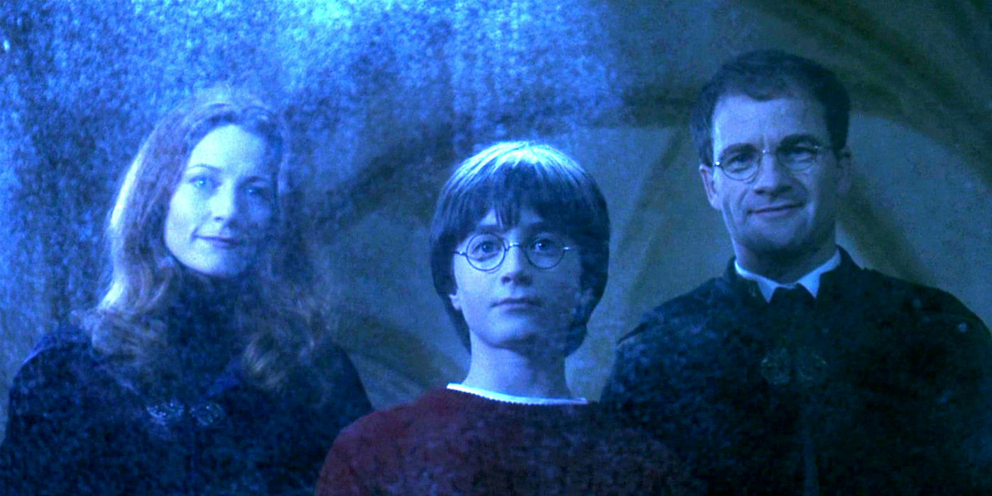 Lílian, Harry e Tiago Potter em Harry Potter e a Pedra Filosofal (Reprodução)