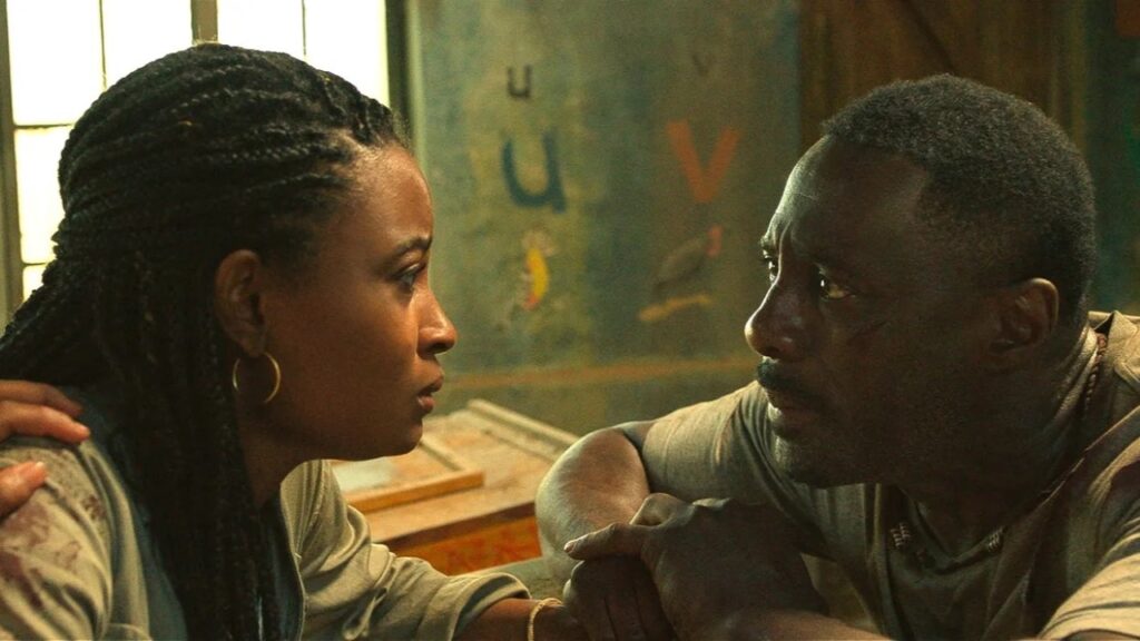 Idris Elba não conseguiu escalar a própria filha em A Fera Meredith (Iyana Halley) e Dr. Nate Samuels (Idris Elba) em A Fera (Reprodução)