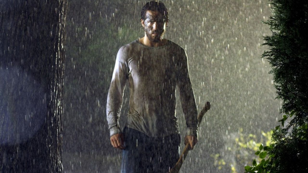 Amityville: conheça a franquia de terror tão extensa quanto o MCU 3 Ryan Reynolds é George Lutz em Horror em Amityville (2005) (Reprodução)