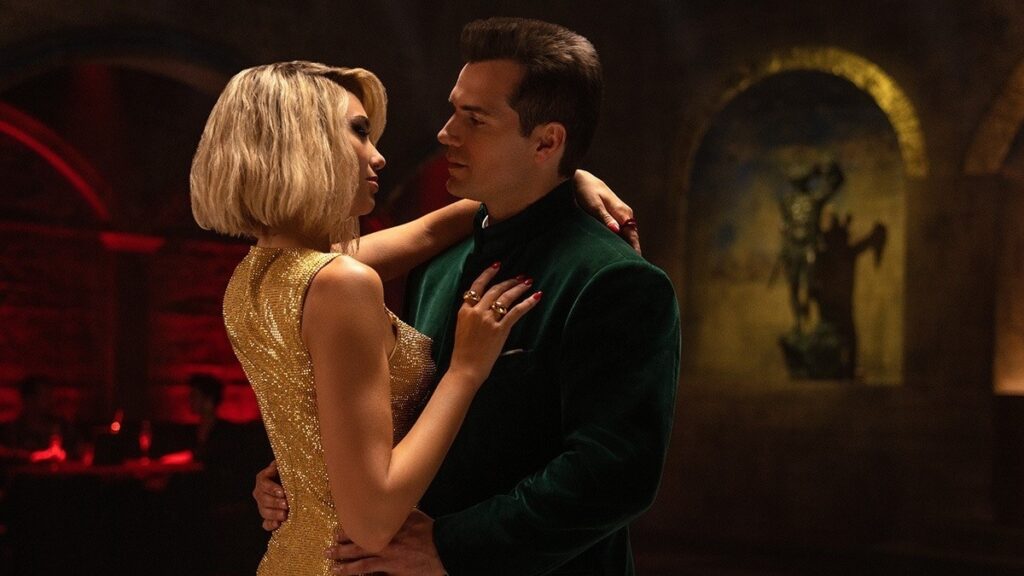 Dua Lipa precisou da ajuda de Henry Cavill em Argylle? Ator respondeu Dua Lipa e Henry Cavill em cena de Argylle - O Superespião (Reprodução / Universal Pictures)