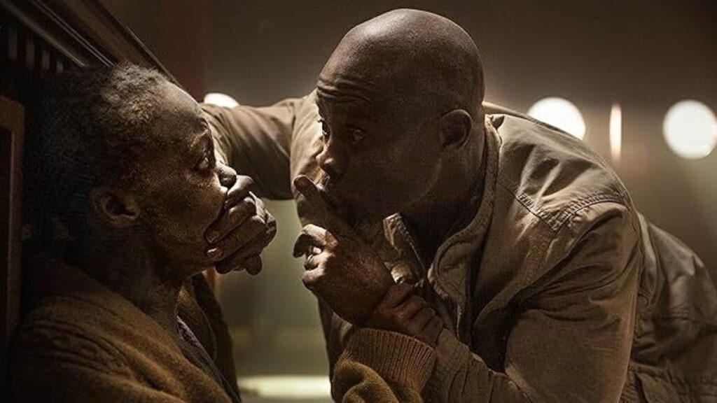 Primeiras impressões de Um Lugar Silencioso: Dia Um são positivas Djimon Hounsou e Lupita Nyong'o em Um Lugar Silencioso: Dia Um (Reprodução)