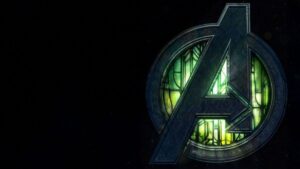 Logotipo dos Vingadores com iluminação verde escura, representando o filme Vingadores Doomsday da Marvel em fundo preto.