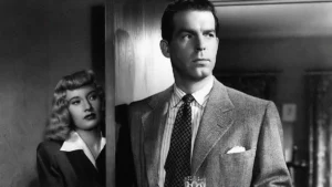 Cena de filmes noir em Pacto de Sangue (1944) com personagens em preto e branco em clima de suspense e tensão