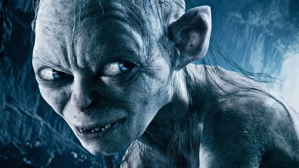 O Senhor dos Anéis: novo filme revela elenco completo com retornos e novidades Gollum em close com olhar intenso em cena de O Senhor dos Anéis na Terra-média
