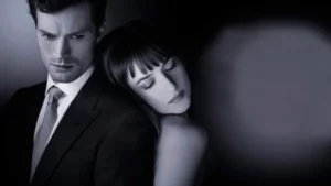 Christian Grey e Anastacia em arte promocional de 50 tons de cinza