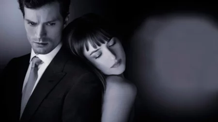 Christian Grey e Anastacia em arte promocional de 50 tons de cinza