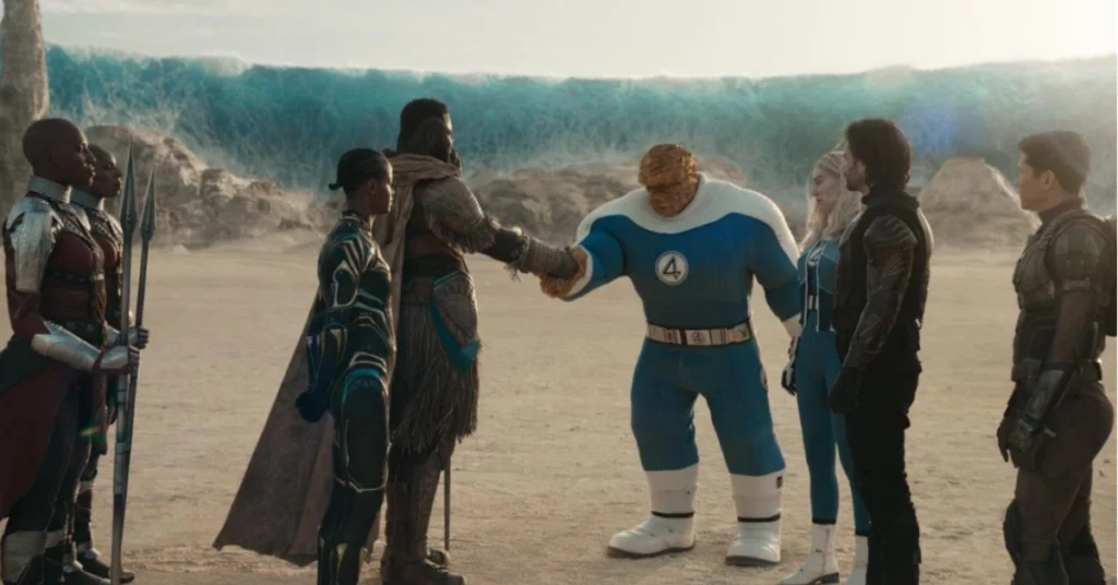Vingadores: Guerras Secretas - Grupo de heróis reunido em cenário rochoso diante de uma grande barreira azul